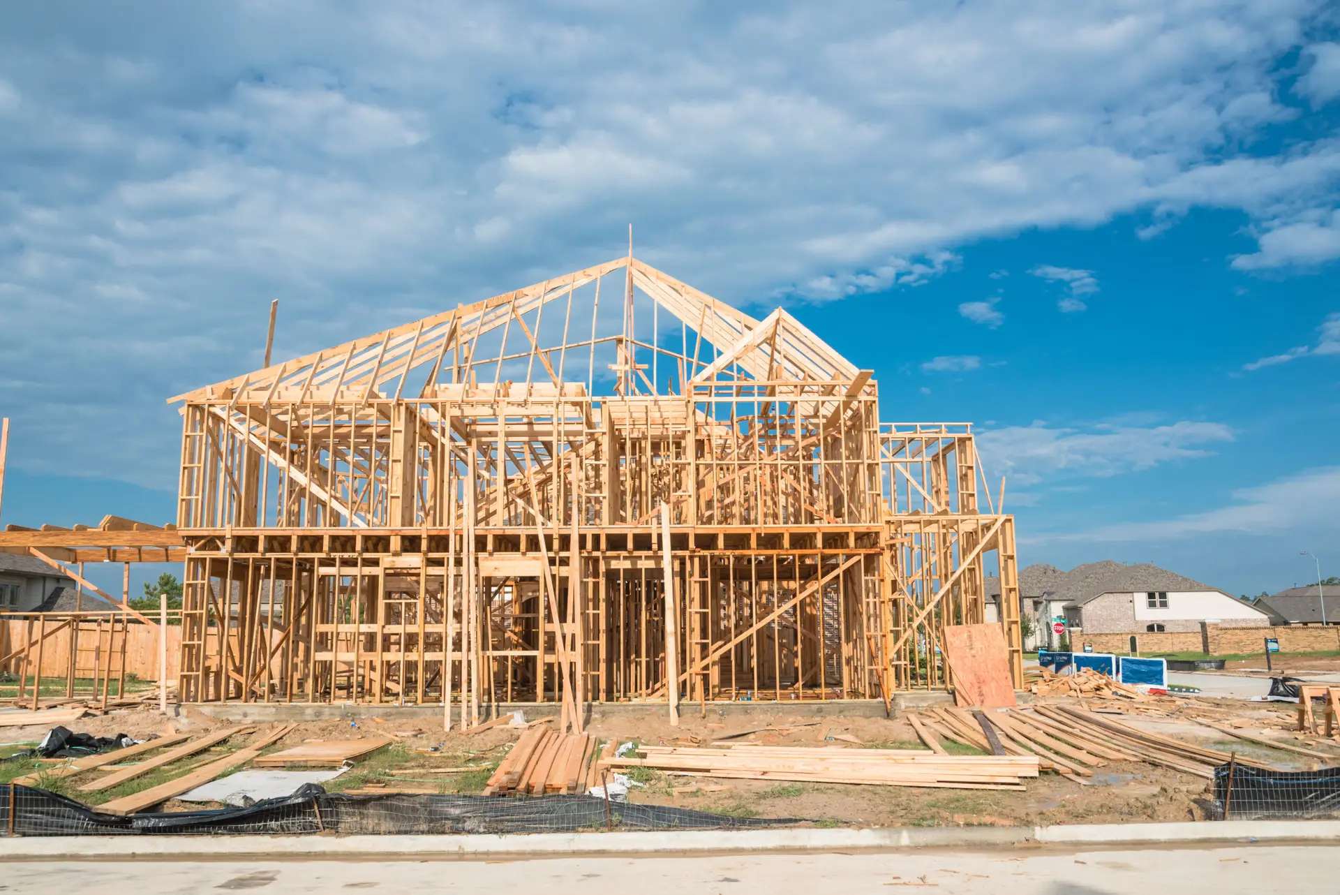 New construction home under construction with framing visible